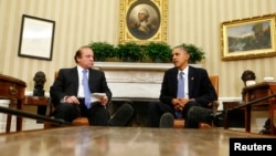 Pakistani Prime Minister Nawaz Sharif (left) says he told U.S. President Barack Obama to halt drone attacks in Pakistan.