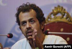 Pakistani journalist Taha Siddiqui talks to reporters after being assaulted by armed men in Islamabad on January 10. He has since left Pakistan.