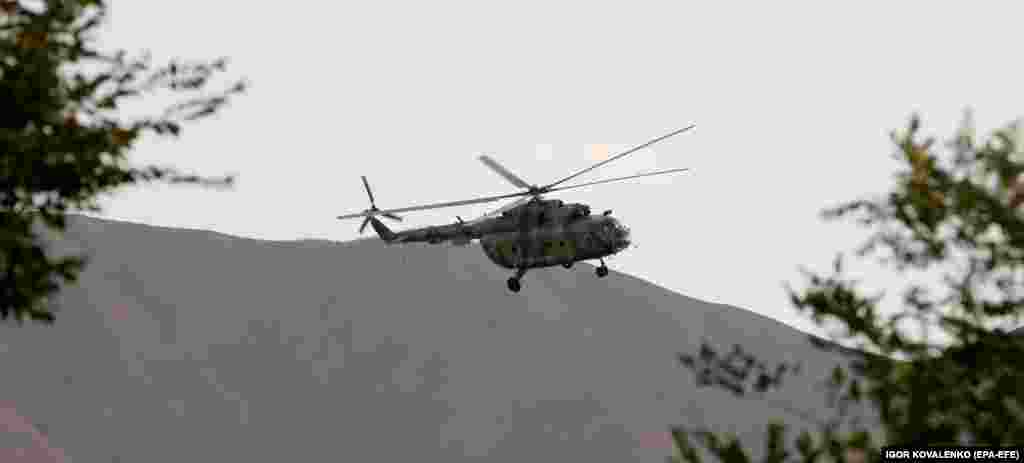 A helicopter above the compound. 