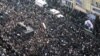 Tens of thousands of Iranians gather around a hearse carrying the coffin of former president Akbar Hashemi Rafsanjani during his funeral ceremony in the capital Tehran, January 10, 2017