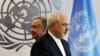 Iranian Foreign Minister Mohammad Zarif walks past United Nations Secretary-General Antonio Guterres at U.N. Headquarters in New York, July 17, 2017 - FILE PHOTO