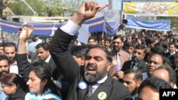 Pakistani lawyers march during a protest in Rawalpindi on March 13.