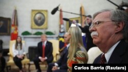 U.S. National Security Advisor John Bolton (R) listens as President Donald Trump, Vice President Mike Pence and White House senior advisor Ivanka Trump meet with Fabiana Rosales, wife of Venezuelan opposition leader Juan Guaido, in the Oval Office> March 27, 2019
