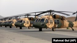 AFGHANISTAN -- UH-60 Black Hawk helicopters are parked at Kandahar Air Field, March 19, 2018