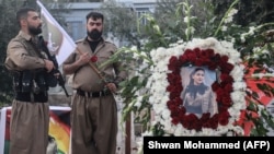 Members of the Iranian-Kurdish opposition based in Iraq mourn the death of a group member following an Iranian drone attack in April.