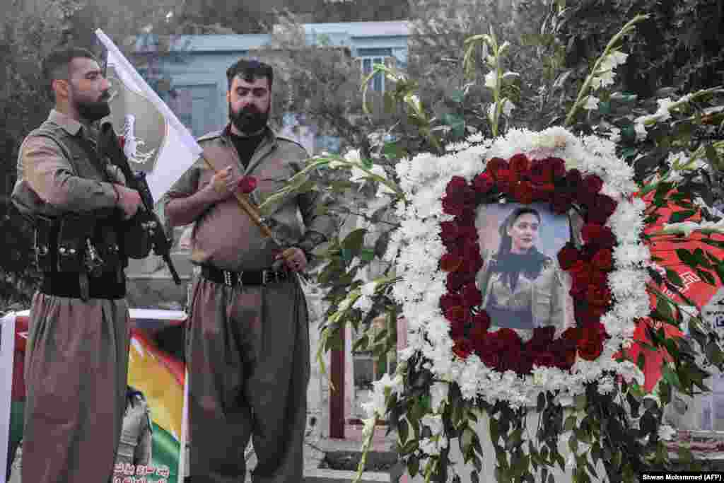 Members of the Komala Party of Iranian Kurdistan gather during the funeral of Ghazal Moulai in Iraq's Kurdistan region on April 16. The female fighter was killed when a drone struck members of the group, which opposes the Iranian regime, two days earlier.