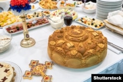 Traditional cesnica bread takes pride of place at many Balkan Christmas tables.