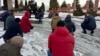 Activists and relatives at the grave of Altynbek Sarsenbaiuly outside Almaty on February 11. 