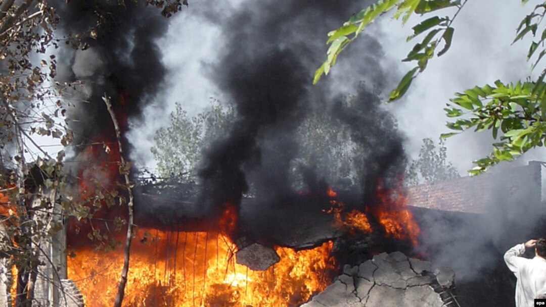 A World Food Program warehouse set on fire by alleged Taliban militants in Swat Valley's Kanju region