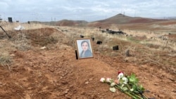 The grave of Aishat Baimuradova in Yerevan on March 27. She was found dead in a rented apartment in Armenia last October after meeting someone reportedly linked to Chechen officials. Her family refused to claim her body, which remained in a morgue for months before her burial.