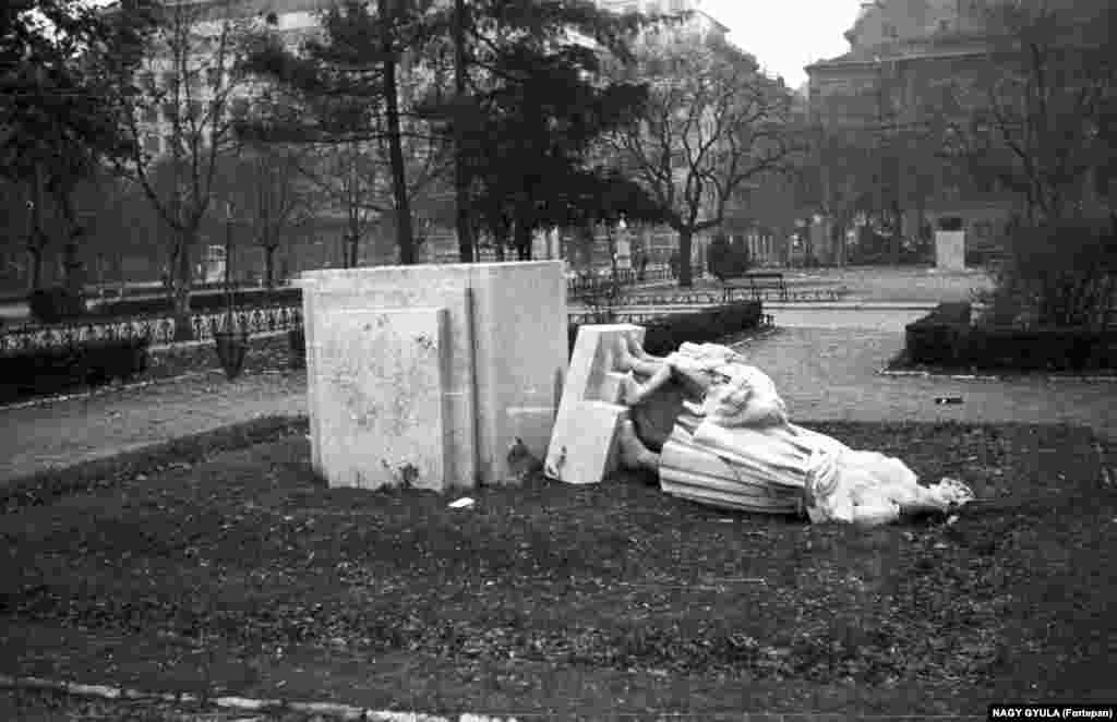 A statue of flower-bearing children, depicted paying homage to Josef Stalin, is seen after being damaged during the Hungarian Revolution.&nbsp; &nbsp;