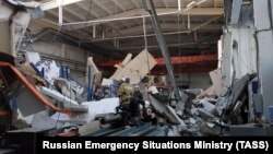 Rescuers work at the site of a collapsed roof at a factory in the town of Dzerzhinsk near Moscow on December 17. 