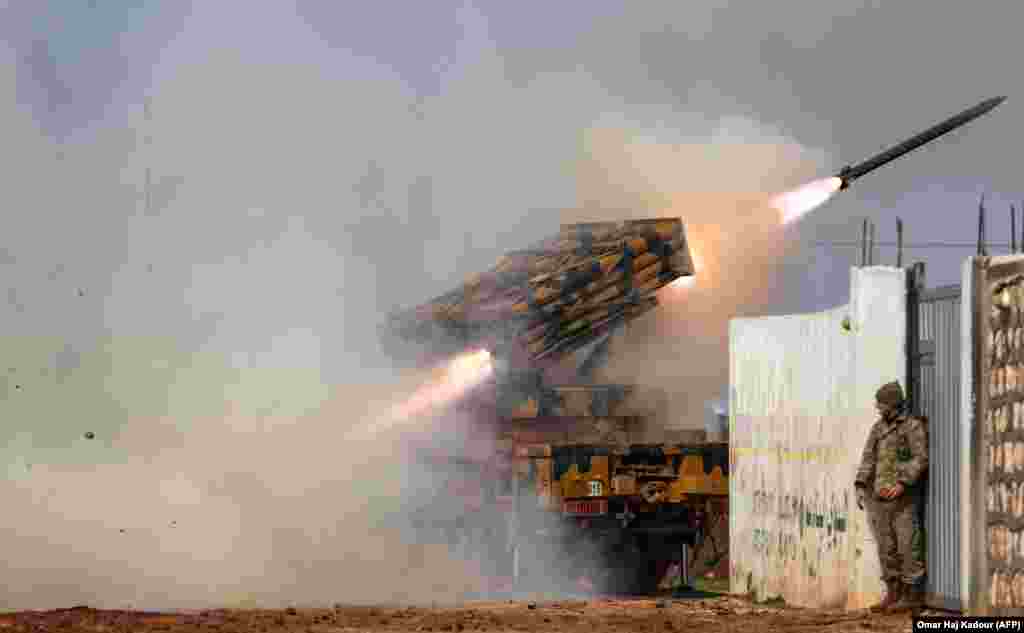 A Turkish mobile rocket launcher fires at Syrian government positions in Idlib Province on February 14. (AFP/Omar Haj Kadour)