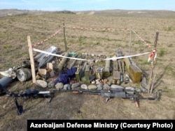 Unexploded munitions gathered together near an uncleared minefield in Azerbaijan's Agdam district.