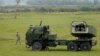 As it battled a full-scale invasion by Russian forces, Ukraine became the world's third-largest arms importer globally, acquiring Western weapons systems, such as HIMARS rocket launchers like this one. (file photo) 