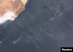 A satellite image shows an oil spill off the coast of Oman on August 11.