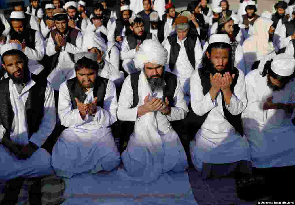 Some of the 900 Taliban prisoners pray on May 26 after being released from&nbsp;Pul-e-Charkhi prison, Afghanistan&#39;s largest detention facility.