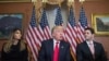 U.S. President-elect Donald Trump speaks to the press with his wife Melania and House Speaker Paul Ryan at the U.S. Capitol in Washington on November 10.