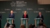 Ireland's prime minister Michael Martin (left) and other government ministers speak to during a press conference to launch the program of the Irish EU presidency in Dublin on June 10. 