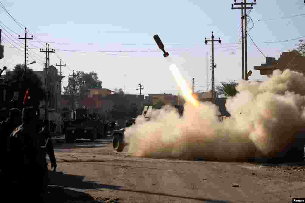 Members of the Iraqi rapid-response forces fire a missile toward Islamic State militants during a battle in the Sumer district of eastern Mosul, Iraq, on January 11. (Reuters/Alaa al-Marjani)