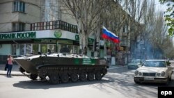 An armored personnel carrier with a Russian flag drives in Slovyansk on April 21.