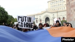 Antigovernment activists demonstrate against Armenia's membership of a Russian-led customs union during a state visit by Russian President Vladimir Putin to Yerevan in December 2013.