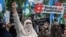 Protesters angered by rising fuel prices triggered by the Middle East war take to the streets of Islamabad on May 15.