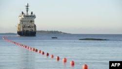 A ship lays the now-damaged telecommunications cable off the shore of Helsinki in October 2015.