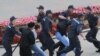 Belarusian policemen detain protesters during a demonstration in Minsk last month.