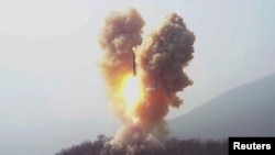 An image released by North Korea's Central News Agency on March 20 shows a missile being fired by the North Korean military at an undisclosed location. 