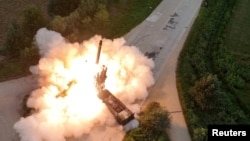 The test-firing of a North Korean multiple rocket launcher (file photo)