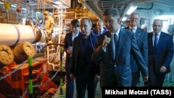 Russian President Vladimir Putin and Gazprom head Aleksei Miller inspect the work on TurkStream aboard a pipeline-laying ship in the Black Sea in June 2017.