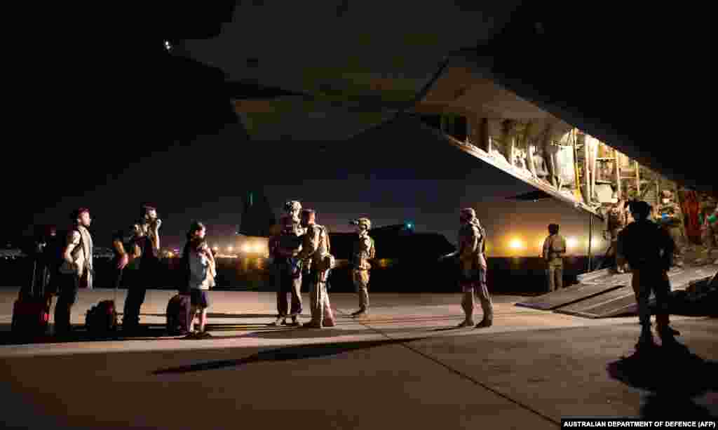 People board the first Australian Defense Force evacuation flight in Kabul on August 18.