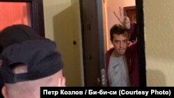 Investigative journalist Roman Dobrokhotov pictured during the search of his apartment by Federal Security Service (FSB) officers.