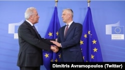 European Commissioner for Home Affairs Dimitris Avramopoulos (left) and Kosovar President Hashim Thaci in Brussels on July 18.