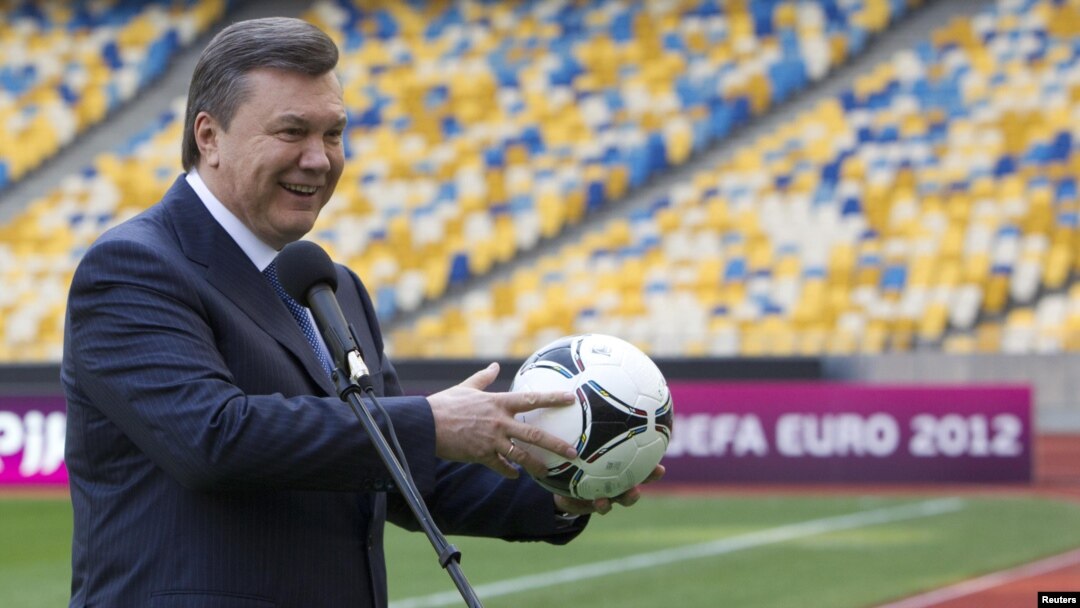 Ukrainian President Viktor Yanukovych plays around in Kyiv's Olympic Stadium, one of the scheduled venues for Euro 2012.