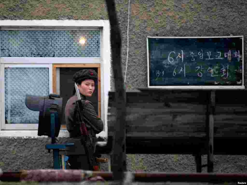 A North Korean soldier guards an army installation on the banks of the Yalu River at the North Korean town of Sinuiju, opposite the Chinese border city of Dandong, October 10, 2006. With world leaders roundly condemning North Korea's announcement it had carried out a nuclear test, U.N. Security Council members weighed an arms embargo and financial sanctions on Pyongyang. REUTERS/Reinhard Krause 