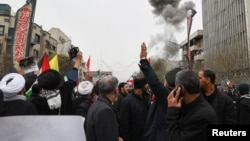 Smoke rises following an explosion during a protest in Tehran marking the annual Al-Quds Day on the last Friday of the month of Ramadan, amid intense US-Israeli air strikes.