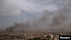 Smoke rises from Beirut's southern suburbs following an apparent Israeli strike on April 5.