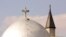 Syria -- FILE --Picture taken 03 May 2001 shows the St. Serge Armenian Orthodox church (front) and the Eastern Gate Mosque in Damascus. Pope John Paul II is expected in Syria 05-08 May as part of a larger trip that will also take him to Greece and Malta o
