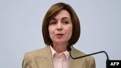 Moldova's President Maia Sandu attends a press conference at her campaign headquarters in Chisinau early on October 21. "Criminal groups working with foreign forces have attacked our country with tens of millions of euros, lies, and propaganda...to keep our country trapped in uncertainty and instability," she said.