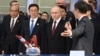 Russian President Vladimir Putin (center) and Chinese Vice President Han Zheng (second from left) visit the Russian-Chinese EXPO in Harbin, China, in May. 