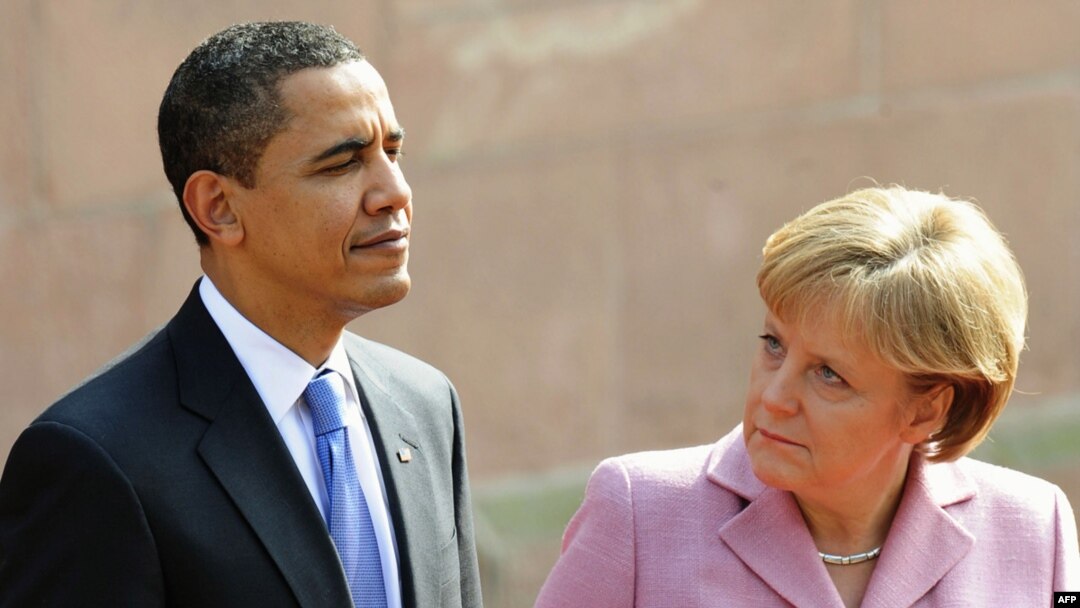 German Chancellor Angela Merkel and U.S. President Barack Obama inspect a military honor guard in Baden-Baden on April 3.