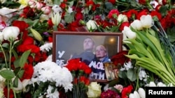 A photograph of Russian opposition politician Aleksei Navalny and his wife Yulia is placed amid flowers on his grave following his funeral at the Borisovskoye cemetery in Moscow on March 2. 