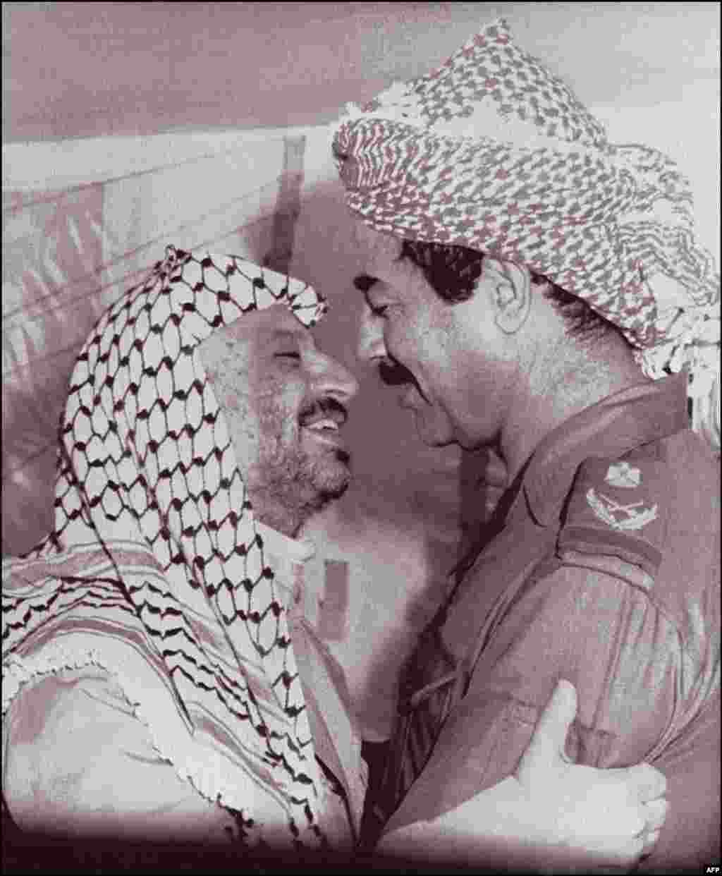 With Palestinian leader Yasser Arafat in 1980. Although Saddam Hussein was popular with some in the Arab world through the 1970s, Arafat would be&nbsp;one of the few global figures to support him during the first Gulf War in 1991.