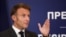 French President Macron speaks to reporters in Belgrade after meeting with Serbian President Aleksandar Vucic.