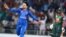 Rashid Khan (left) celebrates the wicket during the first Twenty20 International cricket match between Afghanistan and Bangladesh at Rajiv Ghandi International Cricket Stadium in Dehradun on June 3. 