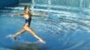 FILE PHOTO:A member of the Ukrainian synchronised swimming team performs its free routine during an Olympic Games qualification tournament at the Olympic Aquatic Centre of the Athens Olympic Sports Complex (OAKA) April 17, 2004. REUTERS/Yannis Behrakis/