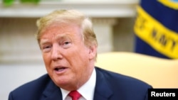 U.S. President Donald Trump speaks to reporters as he meets with Portugal’s President Rebelo de Sousa in the Oval Office at the White House in Washington, U.S. June 27, 2018. REUTERS/Jonathan Ernst