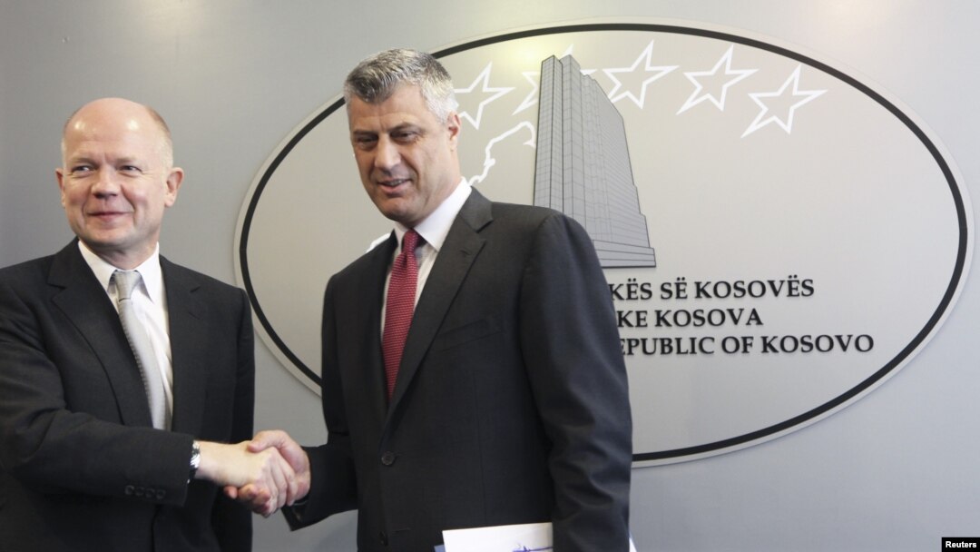 Kosovar Prime Minister Hashim Thaci (right) and British Foreign Secretary William Hague attend a news conference after their meeting in Pristina on October 25.
